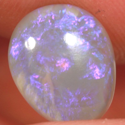 SOLID CRYSTAL OPAL Sparkles of purple over a mauve hue